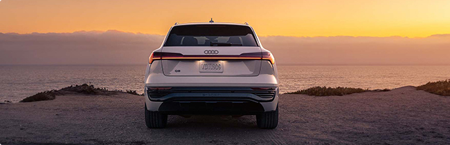 rear view of Audi on beach cliff