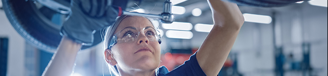 skilled technician servicing a vehicle