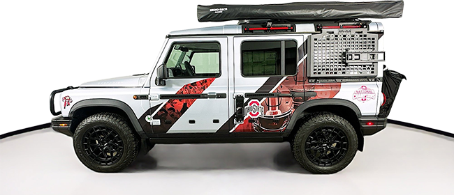 Side view fo the white Ohio State SUV