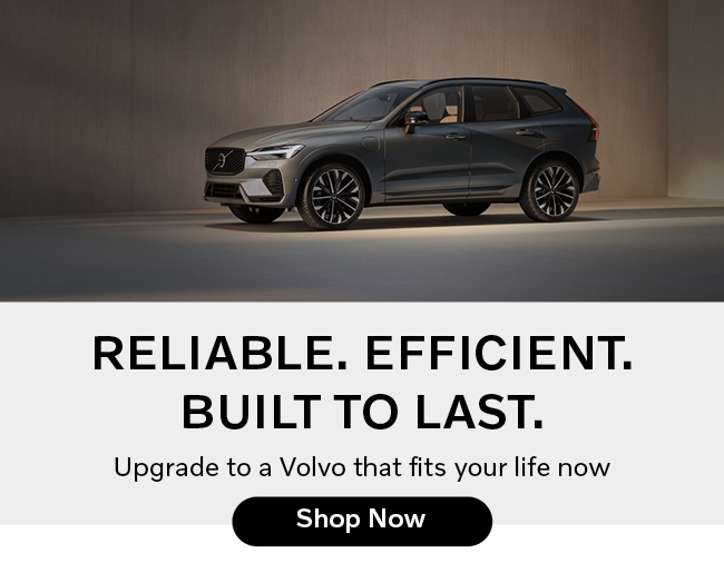 Side view of a gray Volvo with awards in the photo