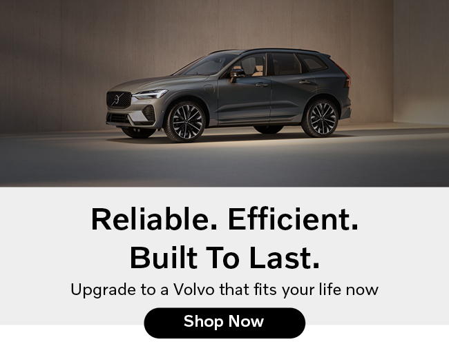 Side view of a gray Volvo with awards in the photo