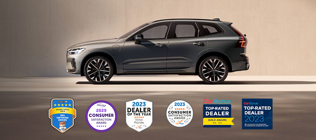 Side view of a gray Volvo with awards in the photo