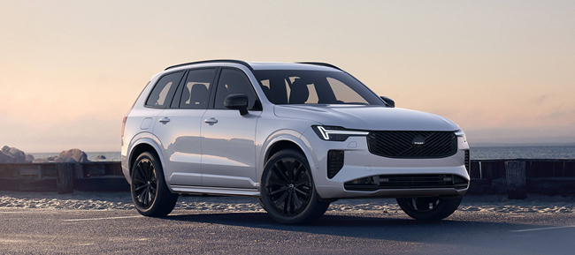 Side view of a gray Volvo with awards in the photo