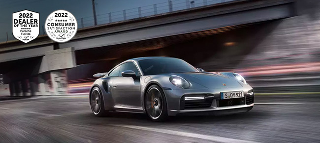 Silver Porsche speeding on a track