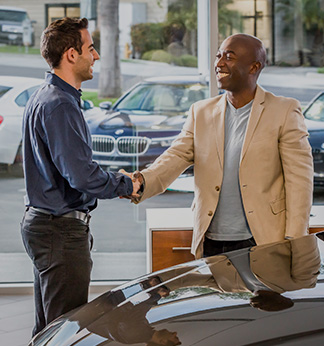 excited family buying a new car