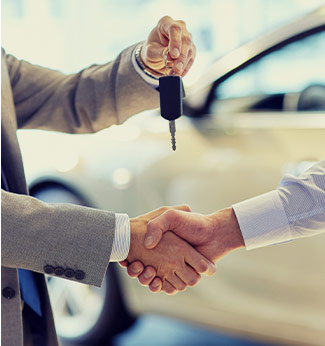 couple shopping at car showroom