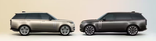 two Land Rovers parked face to face