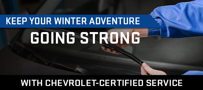 tech checking wipers on car with Chevrolet certified service
