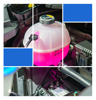 container of pink liquid in engine