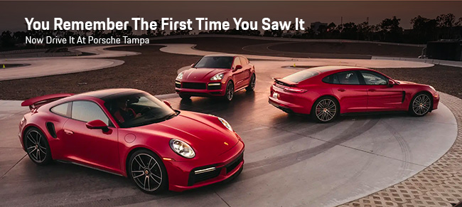 3 red Porsche vehicles parked