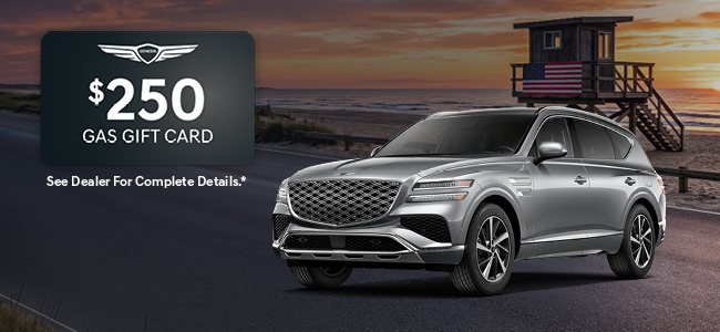 A gray Genesis G80 parked with water in the background
