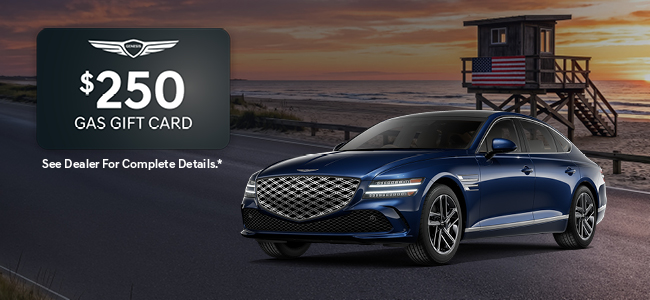 A gray Genesis G80 parked with water in the background