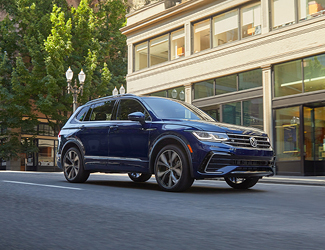 Blue Volkswagen SUV drving in the city