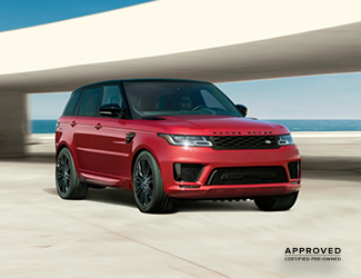 Front view of a parked red Range Rover
