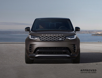 Front view of a parked red Range Rover
