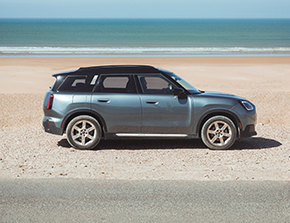 Yellow 2025 MINI COOPER in the city