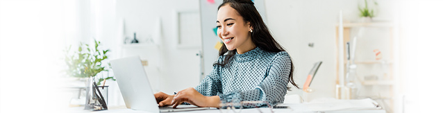 woman visiting car site on laptop