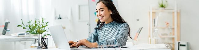 woman visiting car site on laptop