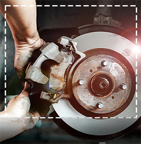 auto mechaninc working on brakes