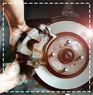 hands of mechanic working on brakes in view