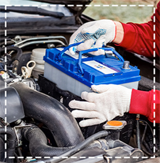 hands of mechanic installing a battery
