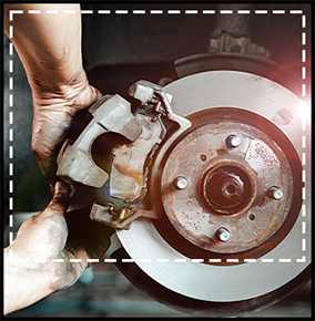 auto mechaninc working on brakes